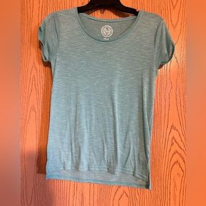 Light bluish green shortsleeved top with cuffed sleeves
